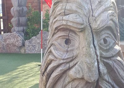 Tribal woodwork around the golf course